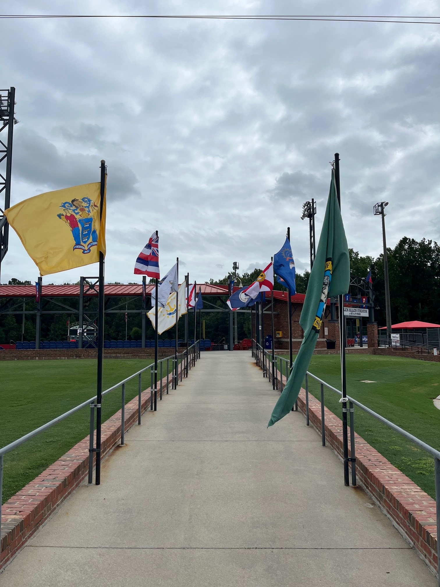 photo of the flags at the entrance to the glen allen stadium at rf&p park for the babe ruth world series
