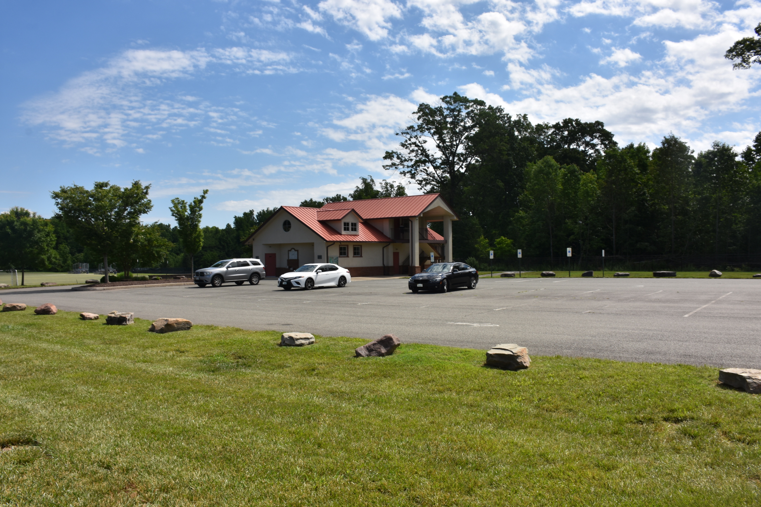photo of parking lot and small building
