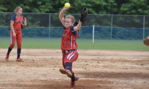 Venue-images-1030-x-618-softball_2 Girl pitching a softball in a red and blue uniform