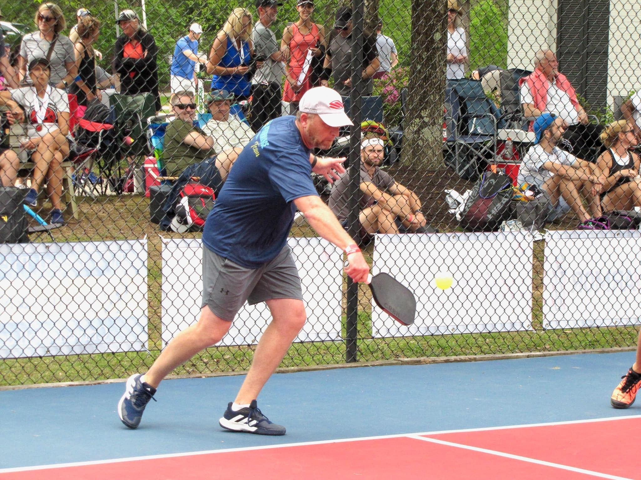 photo of a pickleball player and the crowds at a tournament at the springs pickleball courts