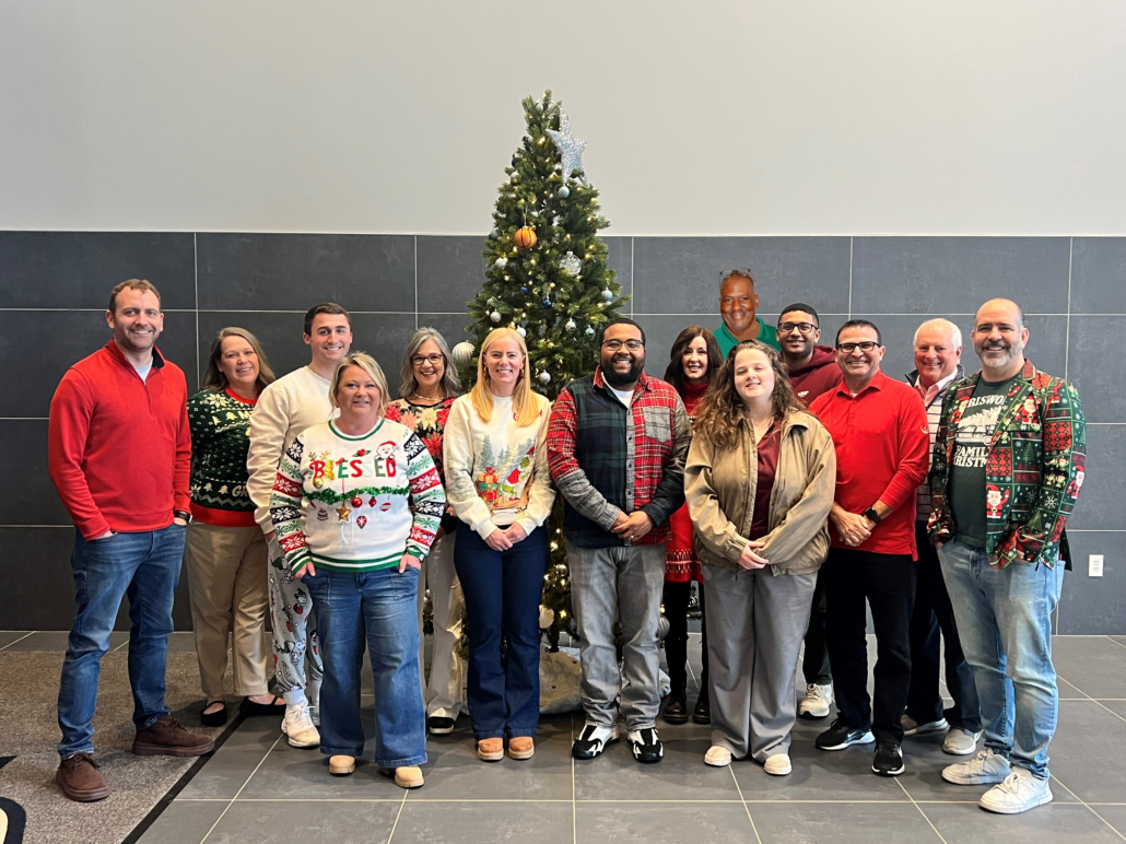 staff photo with elbert staff photo for the henrico sports & entertainment authority in front of a Christmas tree